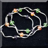 J09. Set of 3 silver tone segmented beaded bracelets. - $10